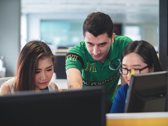 Two woman and one man on computer screen